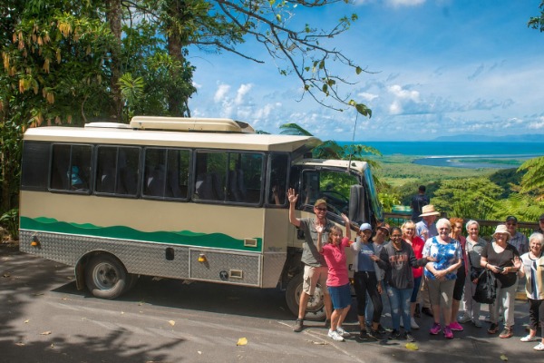 passengers vehicle rainforest A group of passengers next to a vehicle on a Daintree rainforest tour