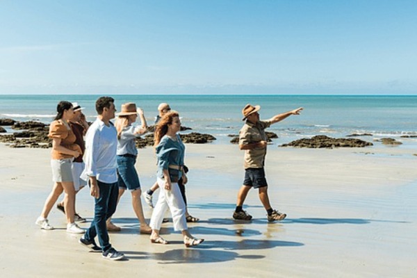 cape tribulation beach walk a group of travelers with guide walking along cape tribulation beach