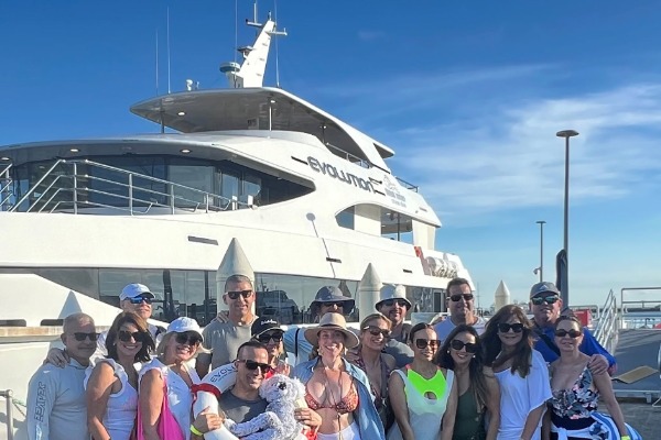 Happy adventurers about to board the superyacht.