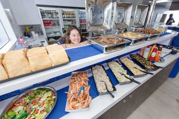 A variety of salads, seafood, and hot dishes served at the buffet bar on the sightseeing boat.