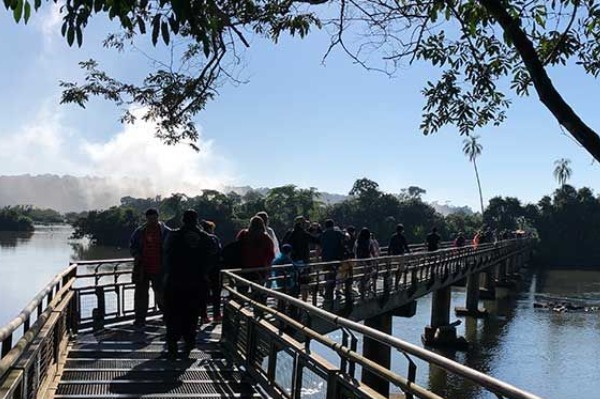 visitors walk along the upper circuit walkway at Iguazu Falls