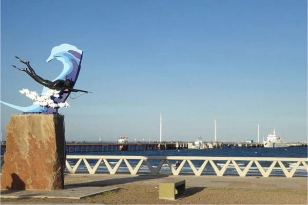 mumument in the port of Puerto Madryn next to the wharf