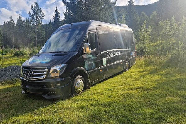return minibus midnight sun excursion vehicle
