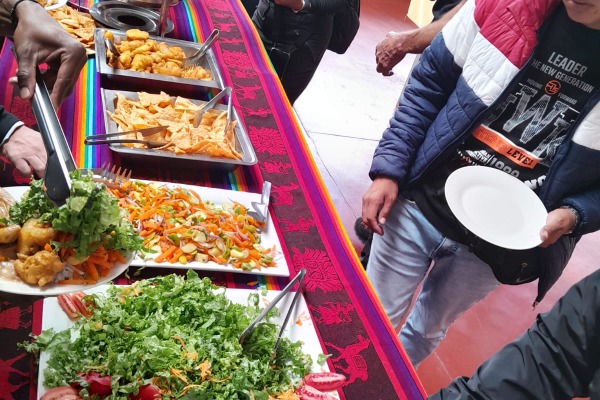 people serving themselves lunch