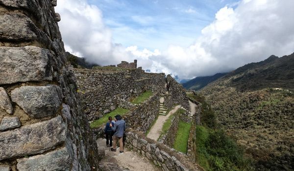 travelers in Phuyuoatamarca the city above the clouds of the Inca trail