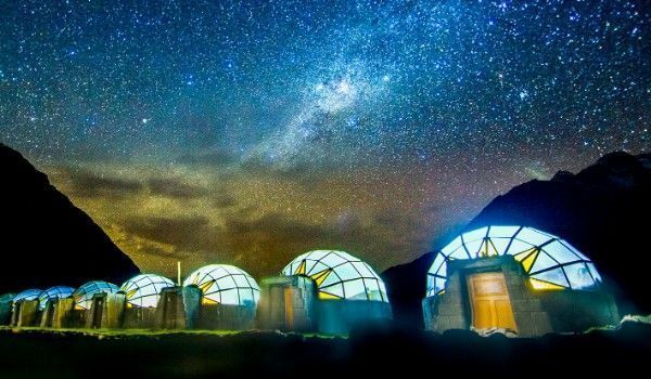 crystal igloos at night under the starry sky at the Sky Camp of Soraypampa