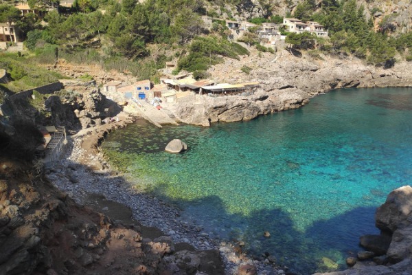 View of Mediterranean cove on the Camí dels Pintors between Deià and Sóller turquoise water cove near Deià on the route GR221 Mallorca